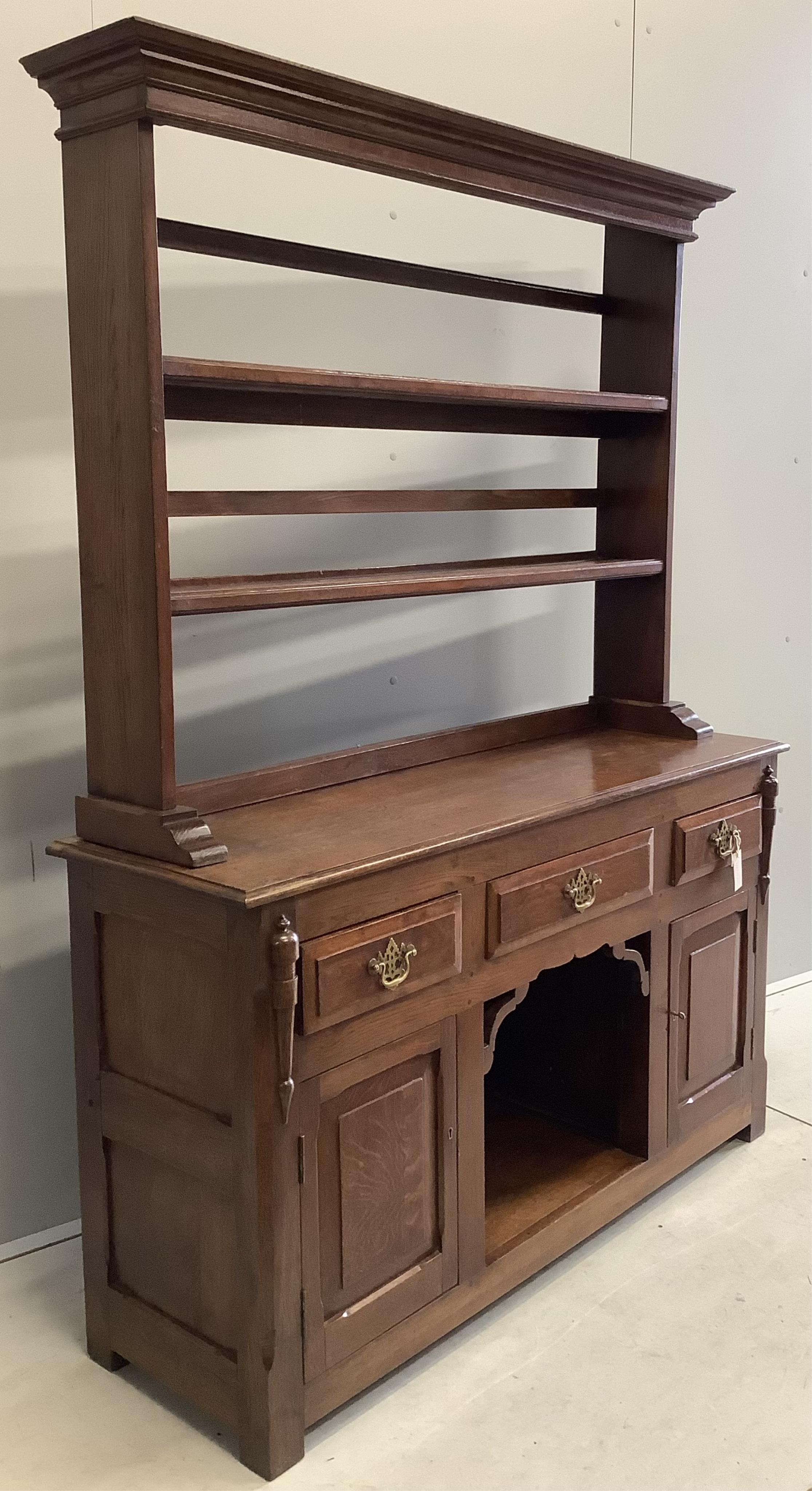 An 18th century style oak 'dog kennel' dresser, with boarded rack, width 138cm, depth 41cm, height 182cm. Condition - fair to good